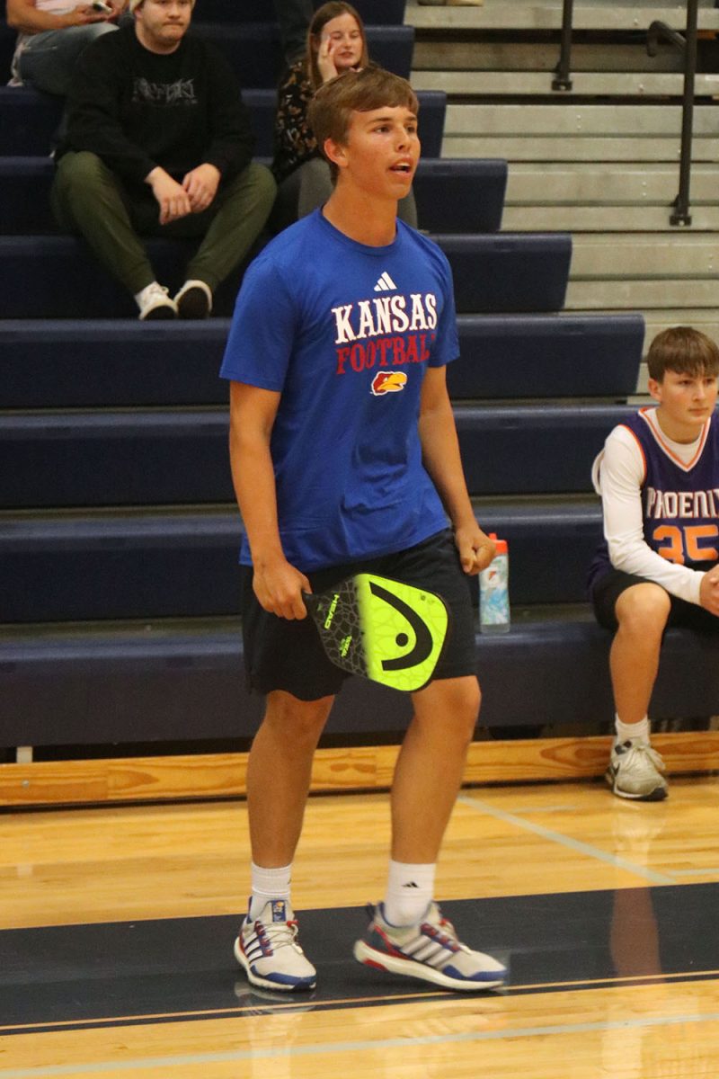 Cheering for his team, sophomore Jack Thomas celebrates the play.
