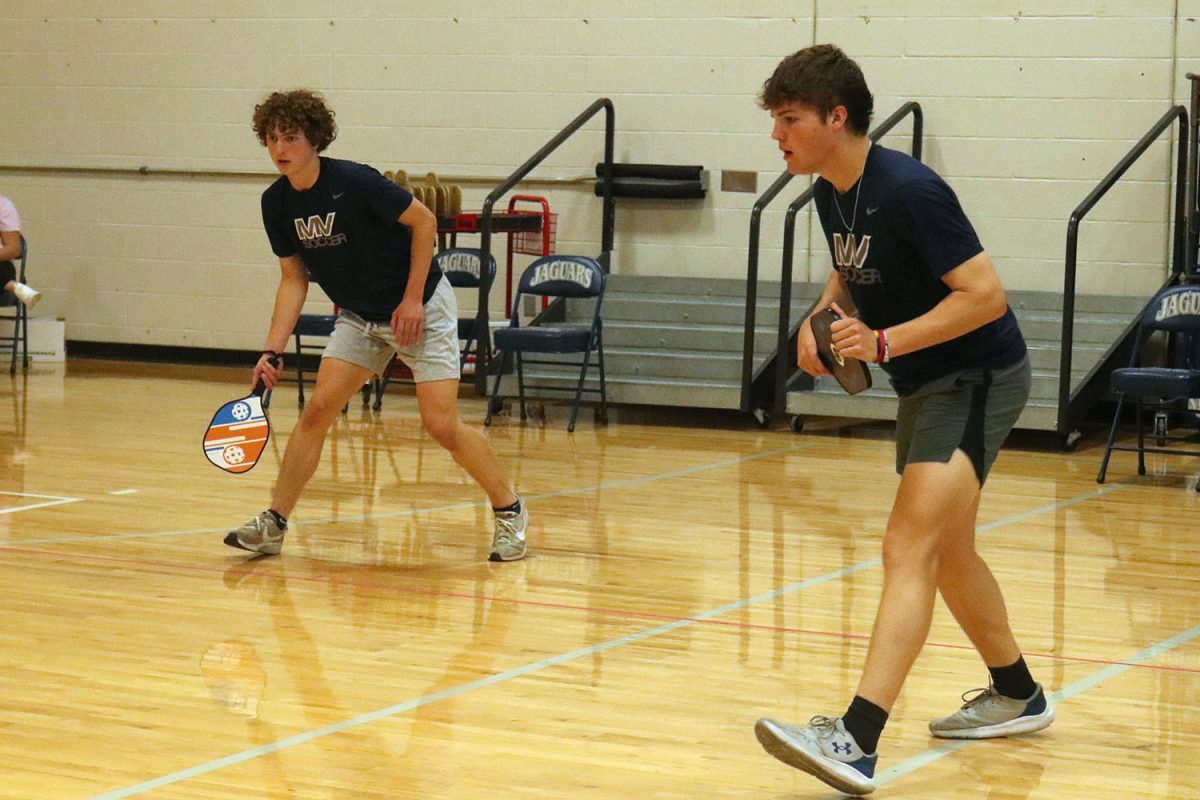 Working together, sophomore Landon Vincent and his partner Joel Hayes prepare to receive the ball. 
