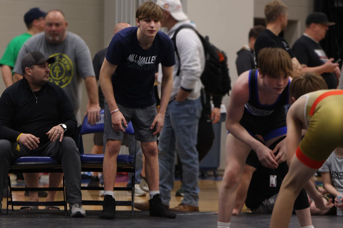 Focused on the match, senior Colin McAlister watches intensely on every move made Saturday, April 6.