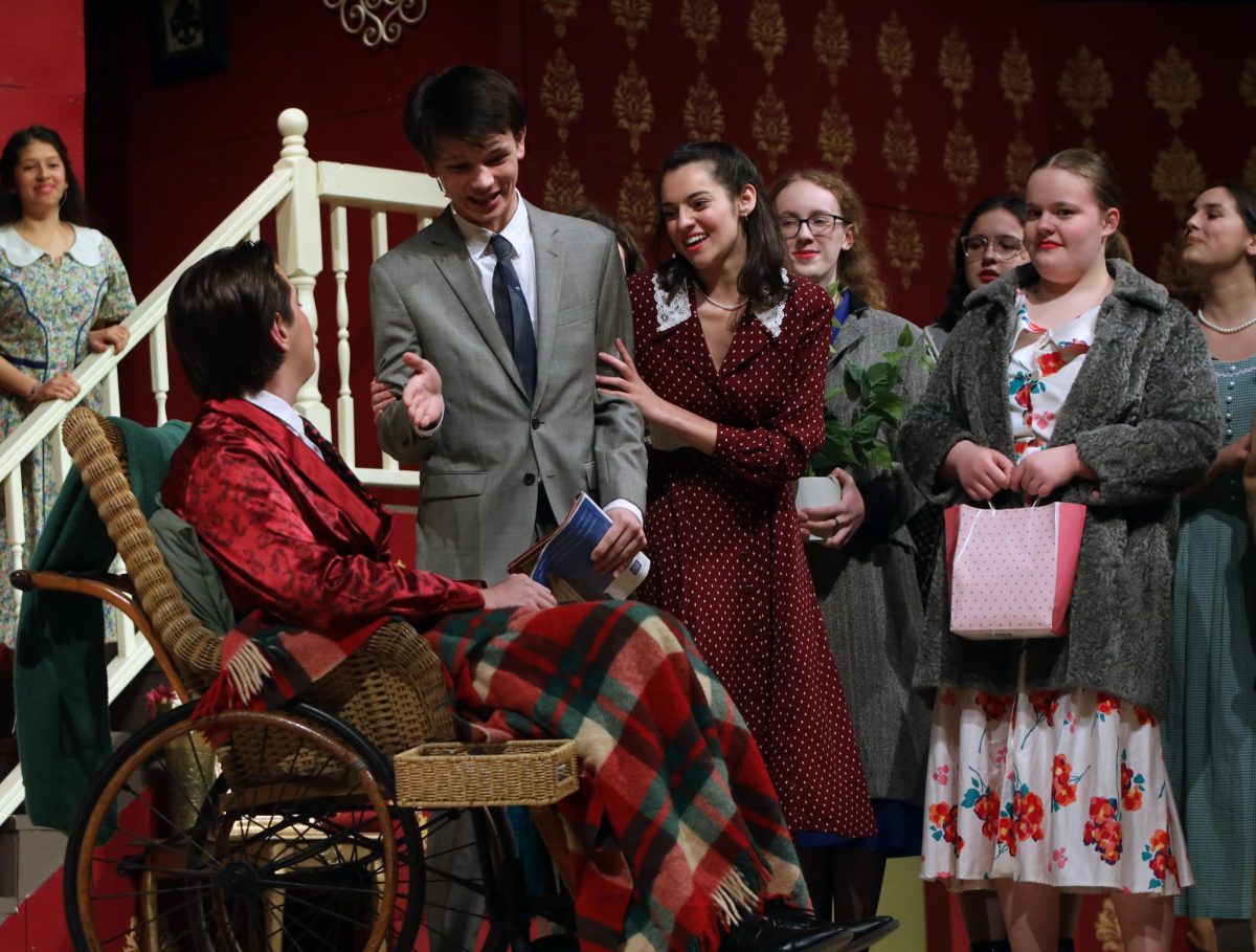 Trying to greet Mr. Whiteside, played by sophomore Barron Fox, Mr. Stanley, played by junior Zane Lauer, holds his hand out for a handshake. 