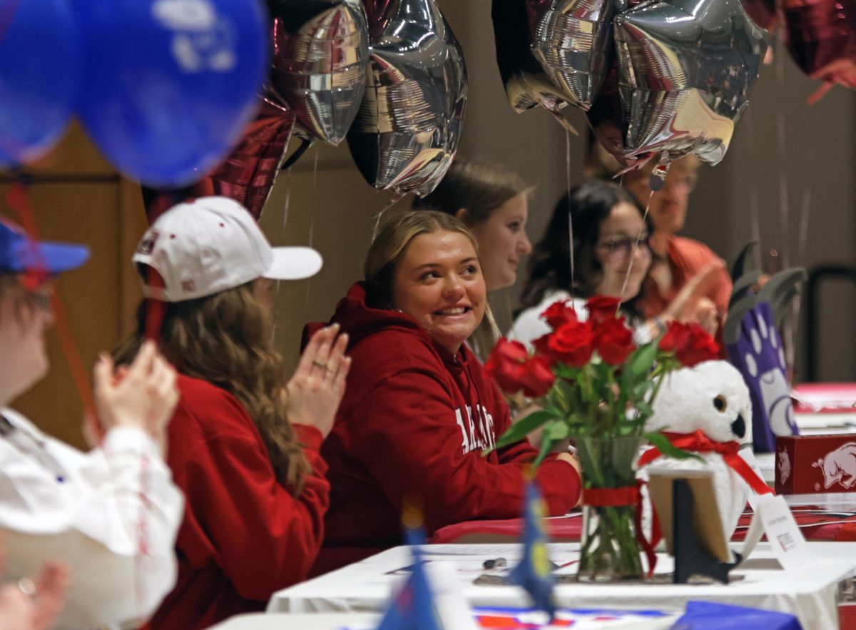 Senior McKinley Graves smiles while everyone claps for her. 