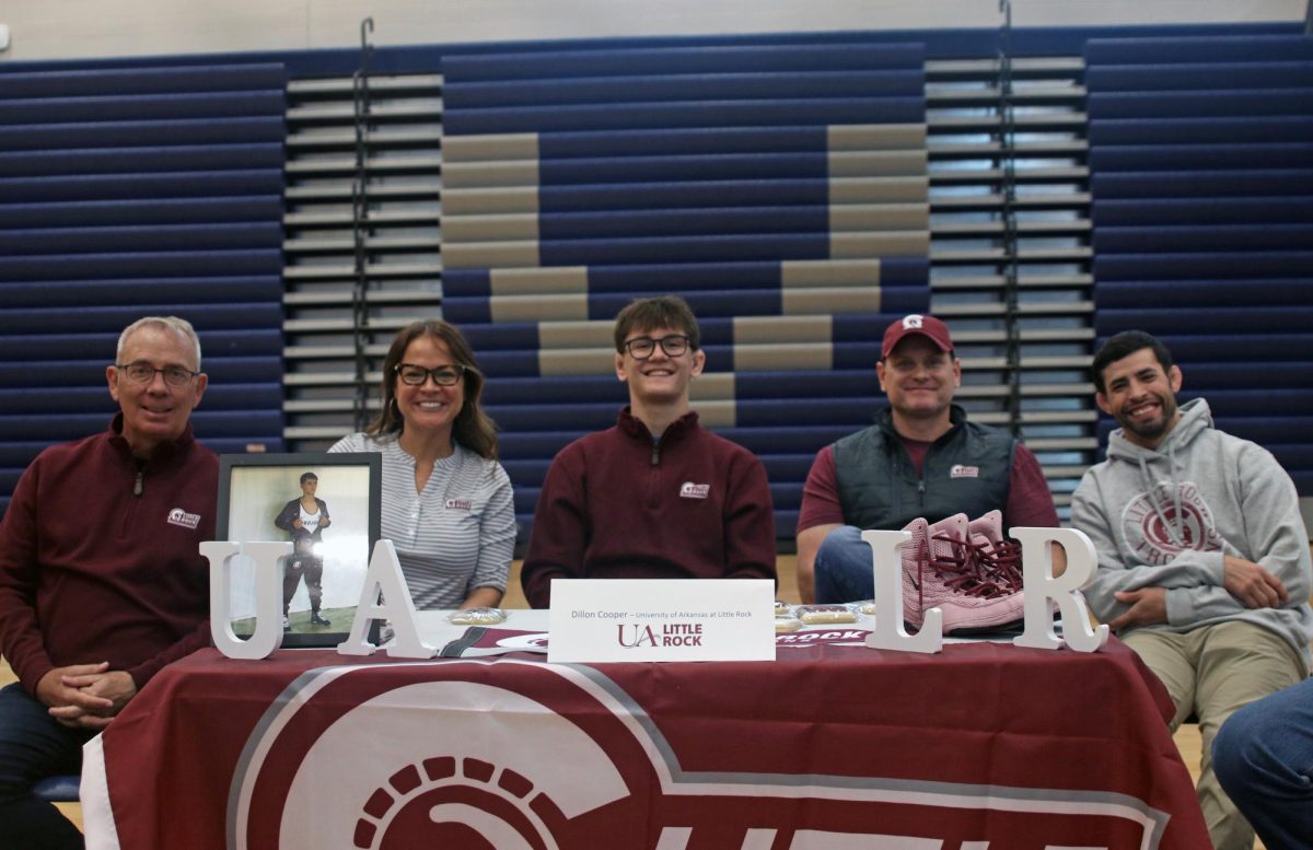 Senior Dillon Cooper signs at University of Arkansas at Little Rock for wrestling. 