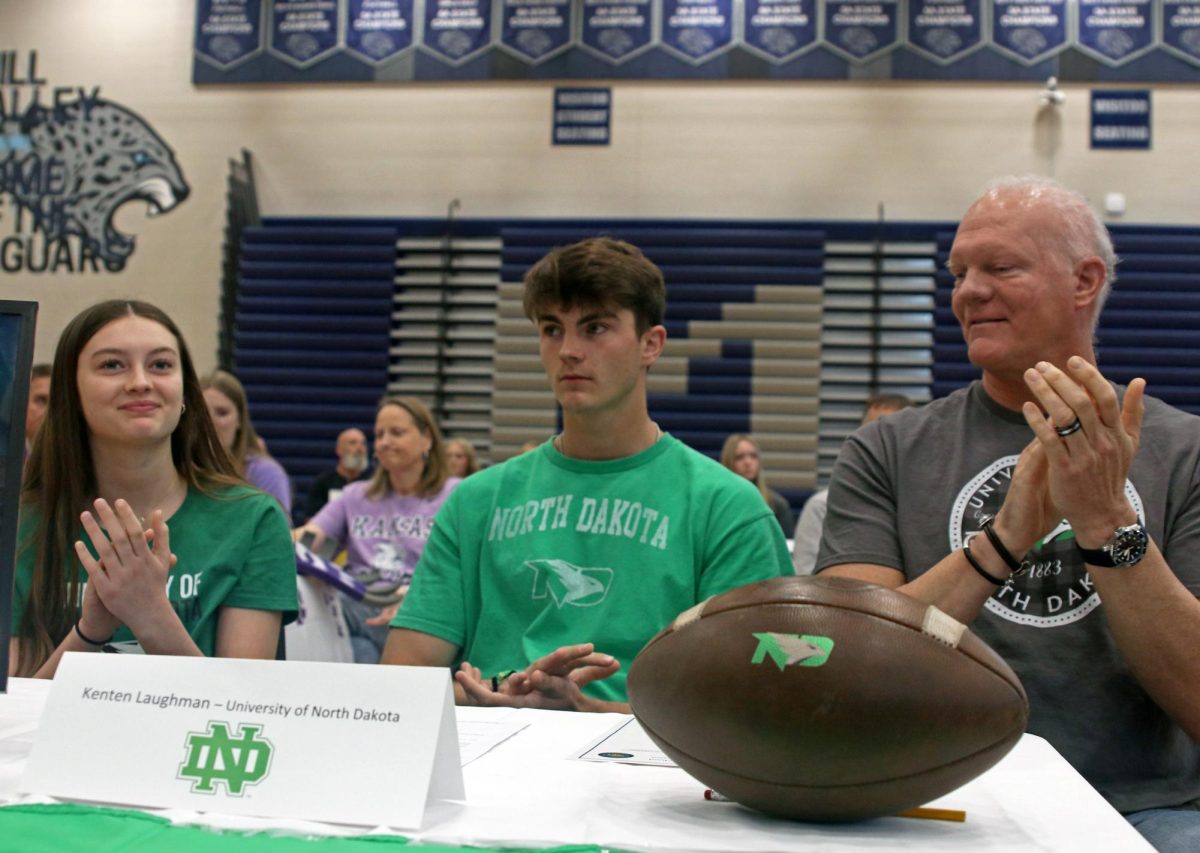 Signee senior Kenten Laughman claps as he prepares for his football career at University of North Dakota. 