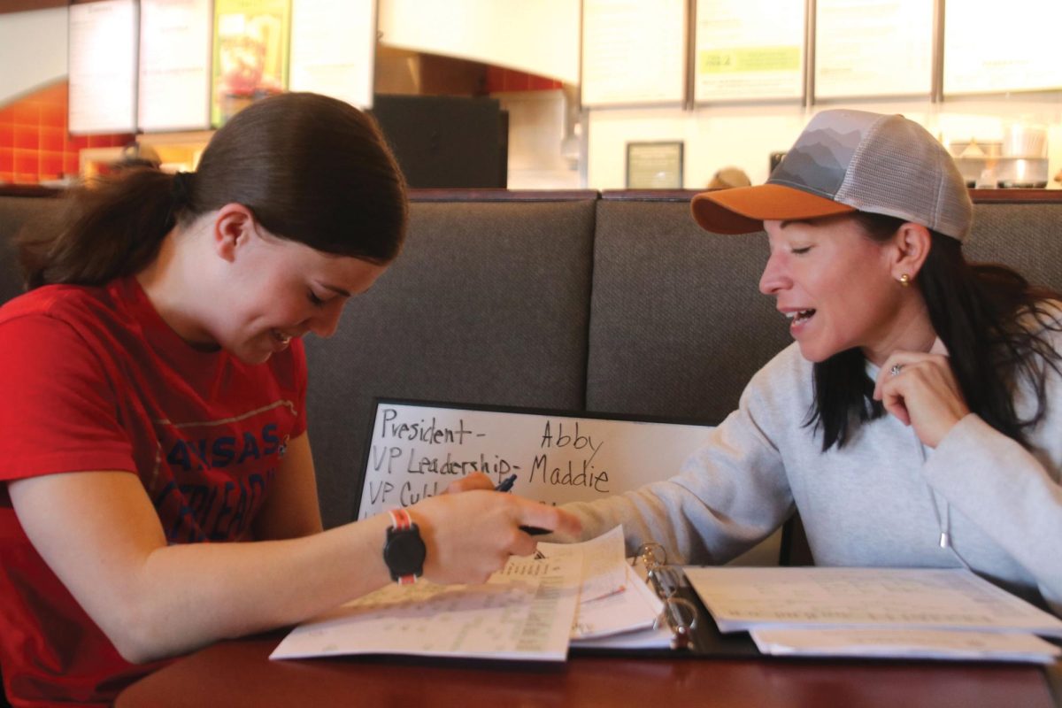 As a part of the nominating committee, sophomore Kyndal Geis and her mother Brittney Geis discuss board positions for next year Saturday, March 30. Each year a group of girls is selected to help choose jobs for their class. These jobs help meetings and volunteering run smoothly 