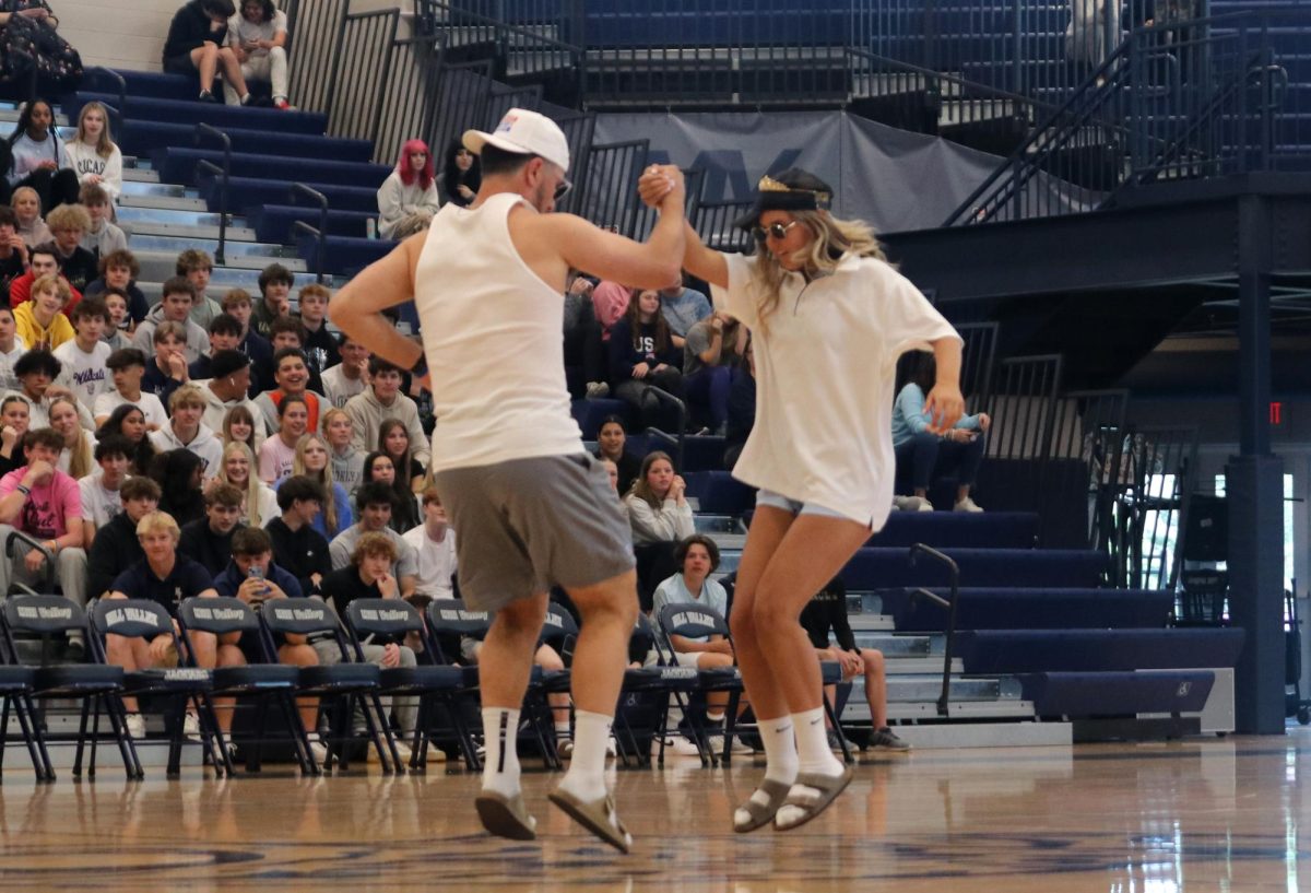 Performing, seniors Abby Wolff and Blake Neis dance away for the crowd at the assembly.