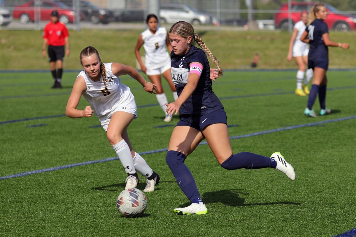 Leg out, senior Brooke Bellehumeur prepares to kick the ball.