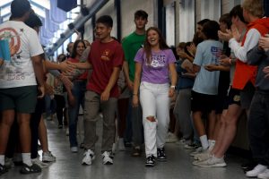 Leading the class, seniors Walt Midyett and Lucy Roy walk with halls one last time.