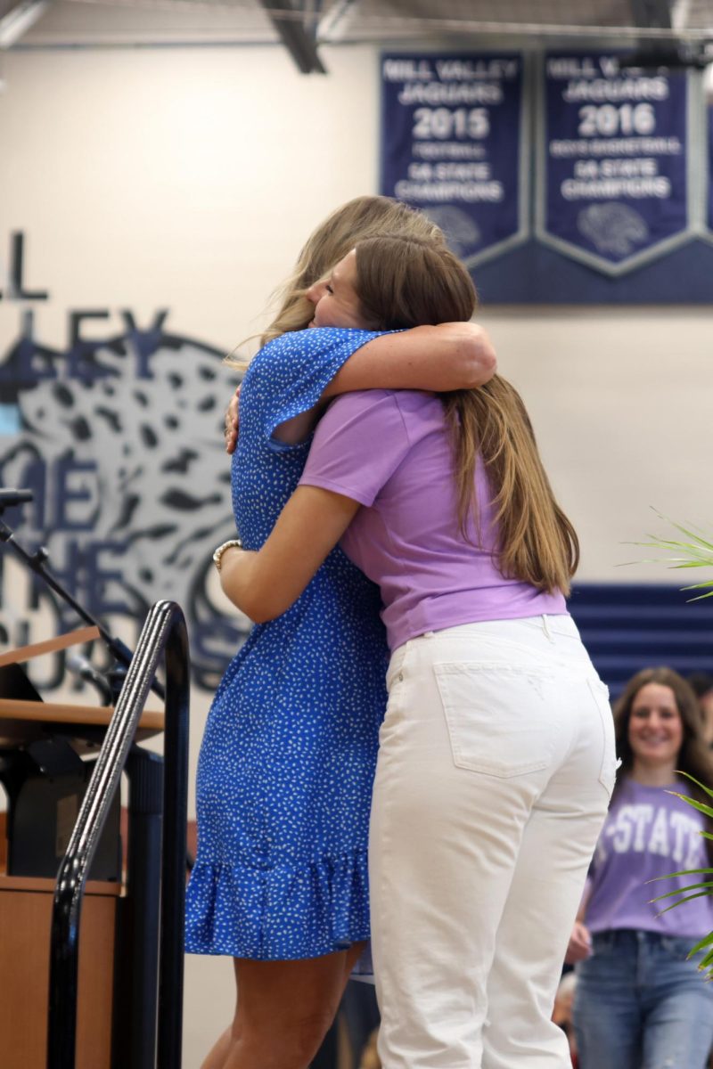 After recieving the Red Cross/STUCO scholarship, senior Lucy Roy hugs STUCO sponsor Faith Bilyeu.