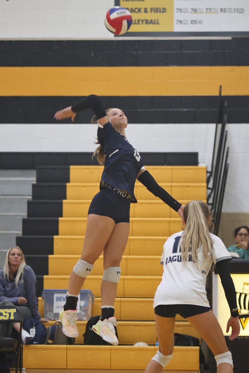 Arm back, sophomore Josie Danielson jumps to hit the ball to her opponents Thursday, Oct 3.