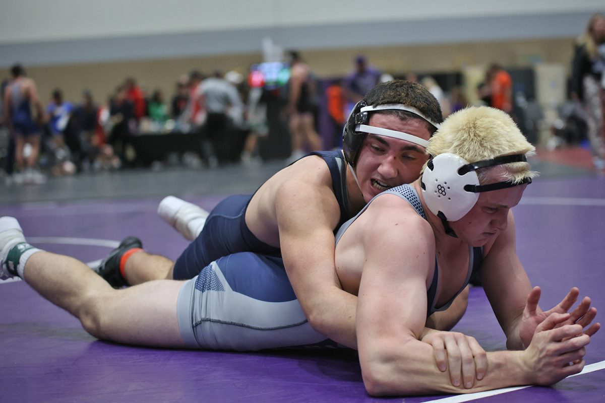 Focused, sophomore Ryder Farley breaks down his opponents base.