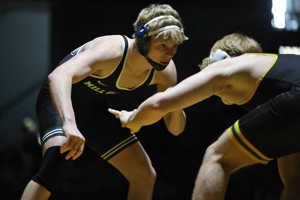 Keeping alert, senior Colton Bendure circles his opponent in the final match. 