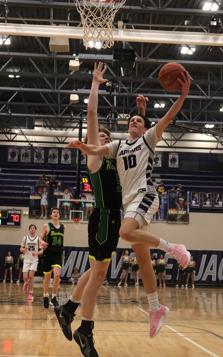 Junior Jack Carpenter goes up for a layup against a Shawnee Mission South opponent.