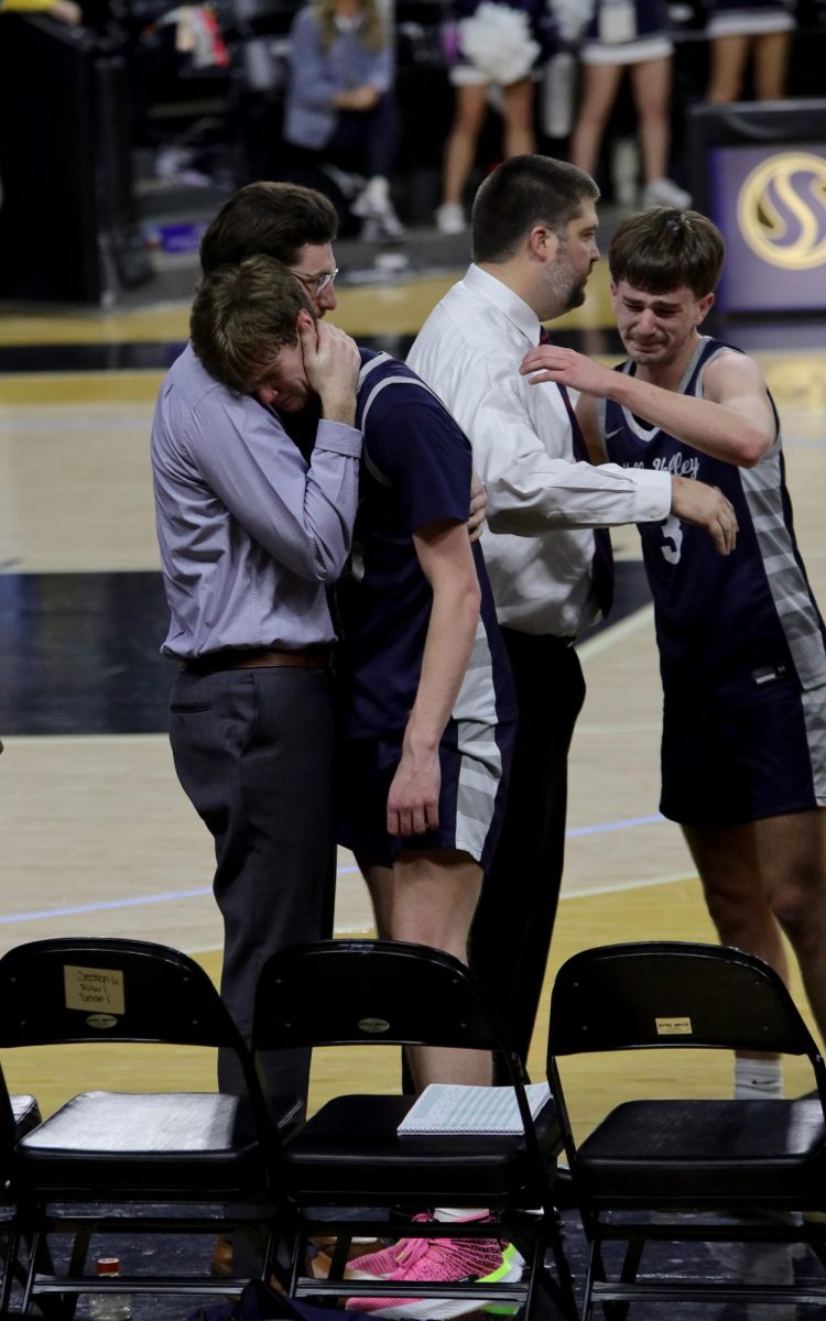 With seconds left on the clock, coaches take out seniors Carter Kaifes and Thatcher Ivey in honor of their last game.