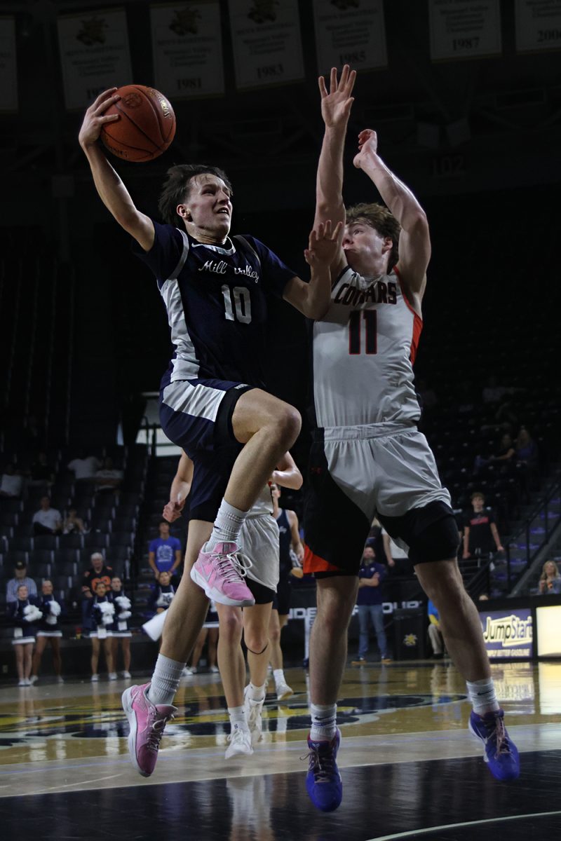 Junior Jack Carpenter looks to make a layup against the Cougars.  