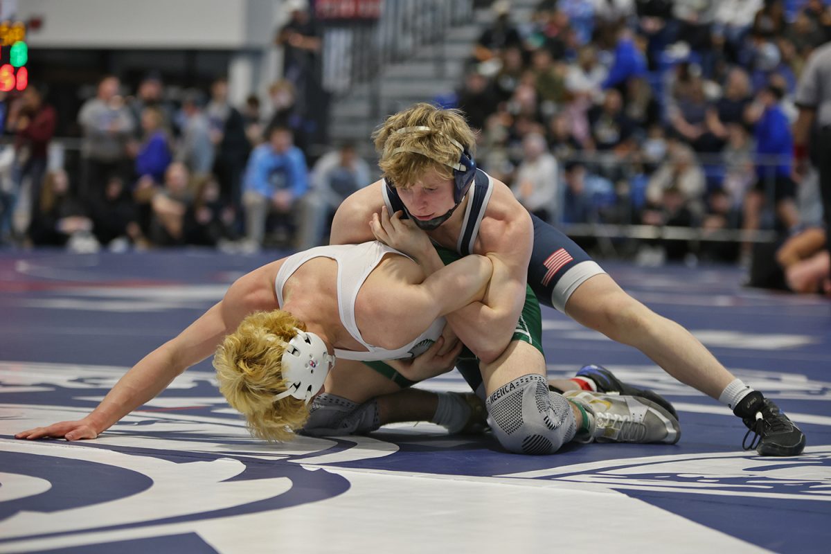 Finding his balance, senior Colton Bendure pulls his opponent's arm across his back. 