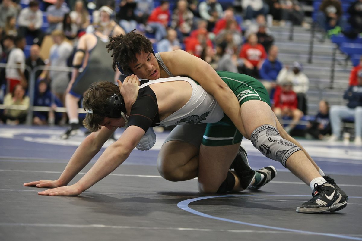 Focused, junior MJ Wash Jr. keeps his opponent down on the mat.