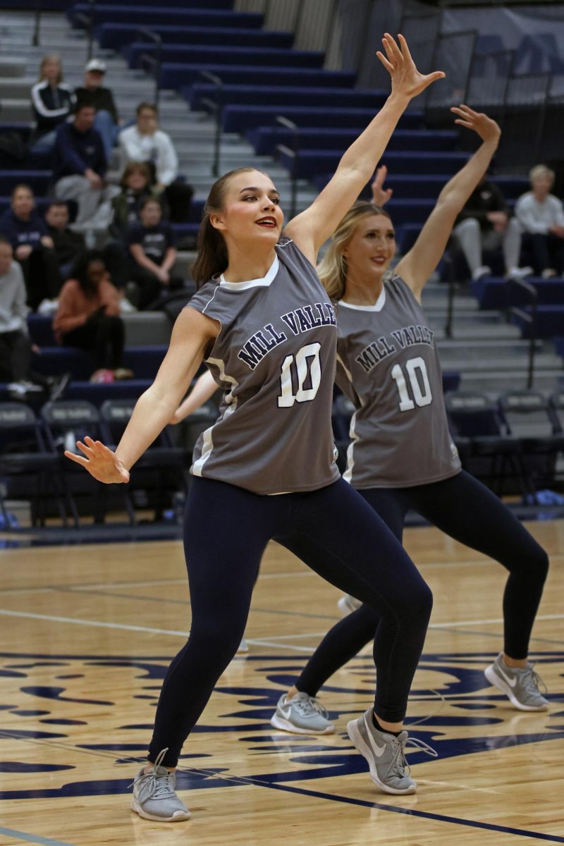 During halftime, senior Josie Mason performs with the Silver Stars Dance team. 