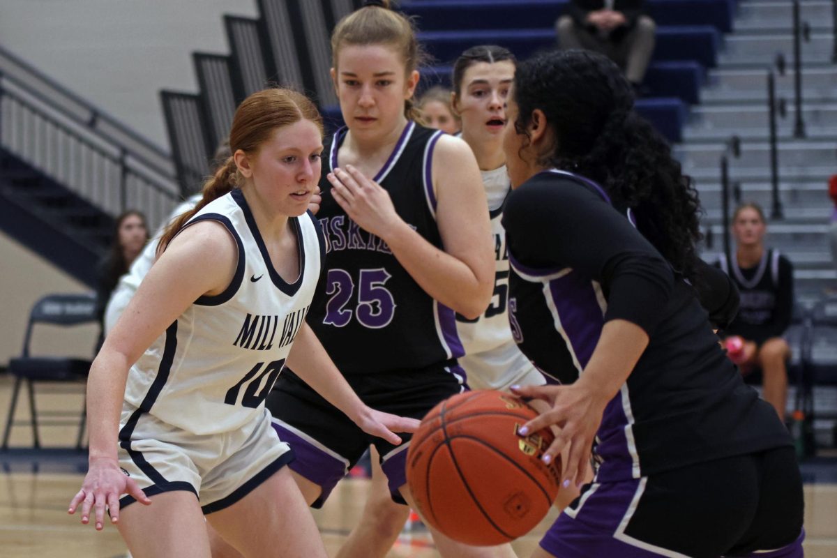 Eyes on the ball, junior Leah Konen stands in front of her opponent.