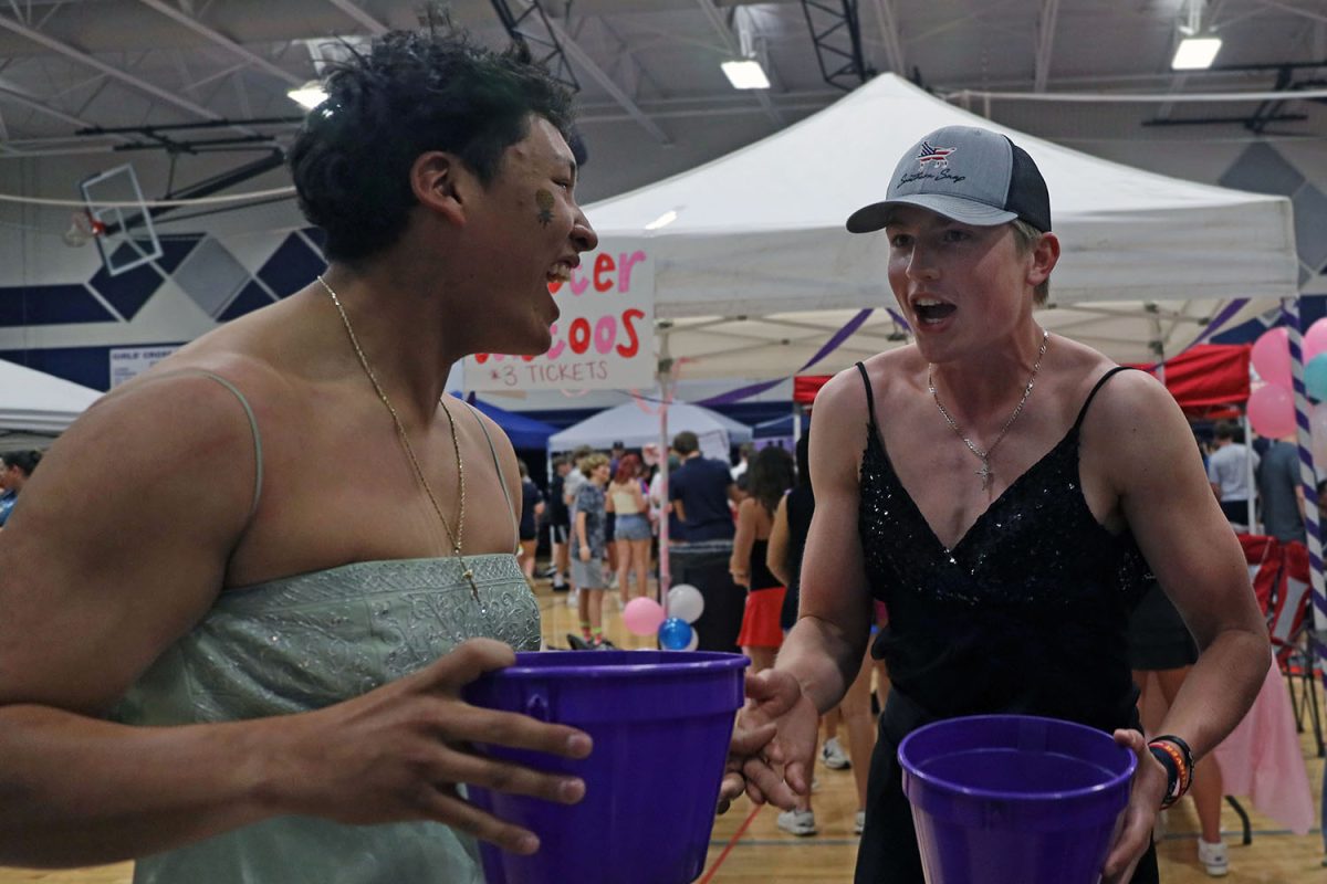 During the Mr. Relay competition, where contestants collect as many tickets as they can, sophomore Josh Garcia and junior Elliott Fischer discuss how many they have so far. 
