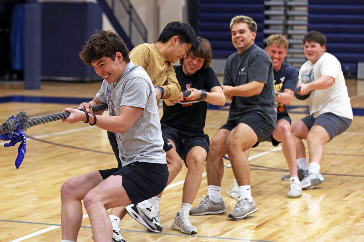 Focused, senior Noah Pham pulls the rope in tug-of-war. 