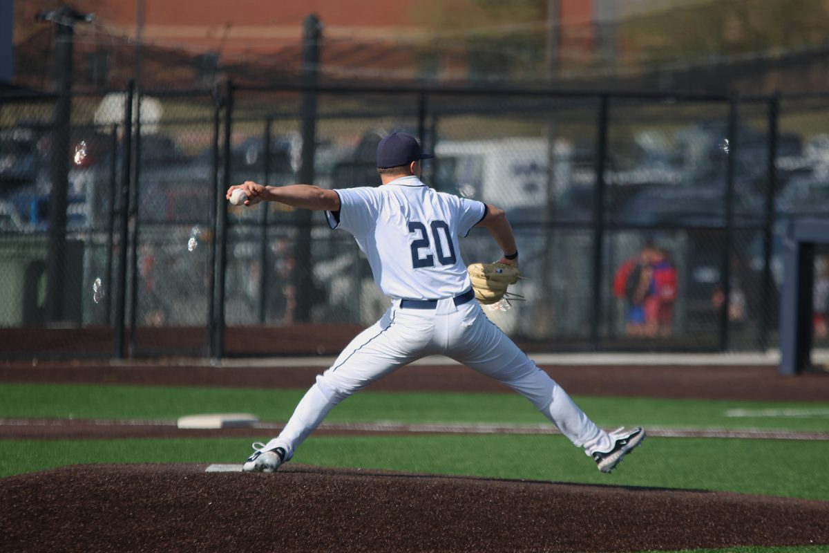 Junior Brandon Neis stretches out to throw