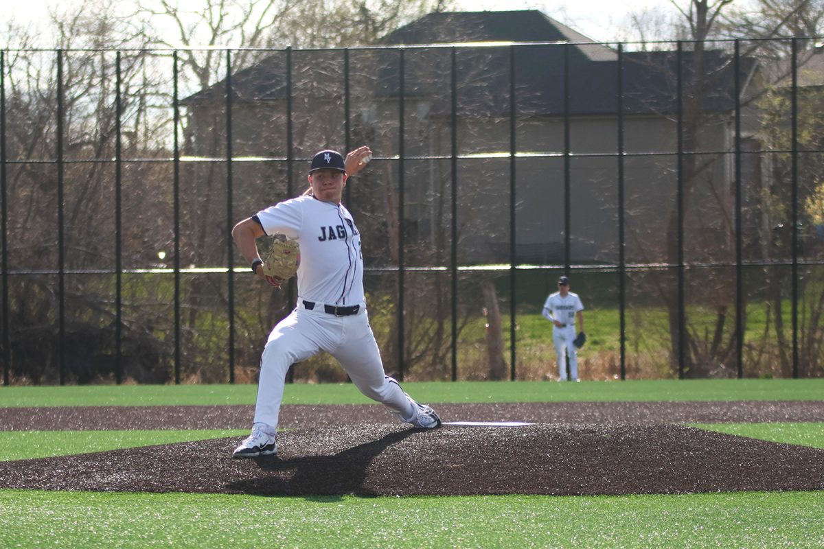 Ready to throw a fastball, junior Brandon Neis strides out