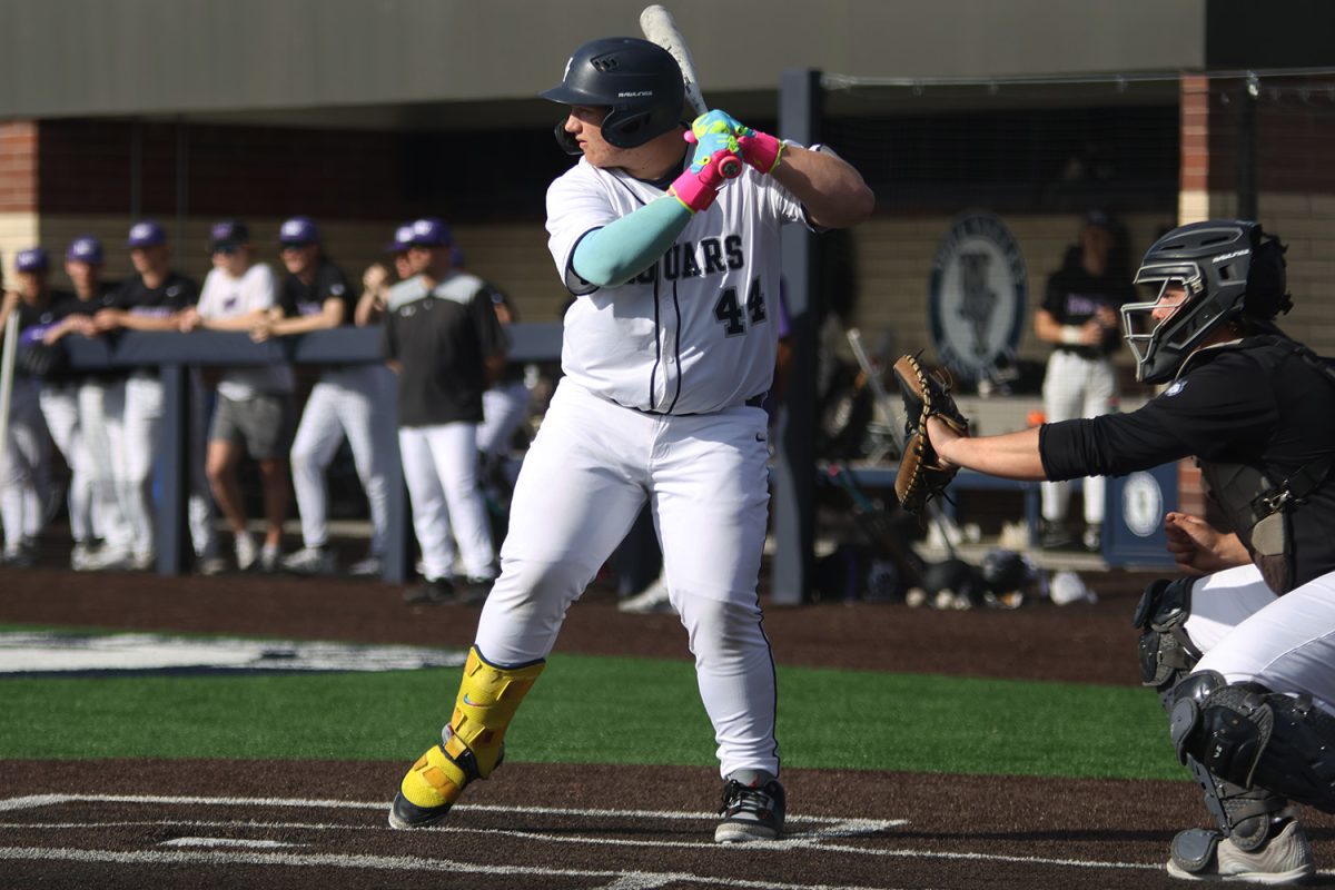 Sophomore Easton Engelhart lifts his leg, ready to take a swing