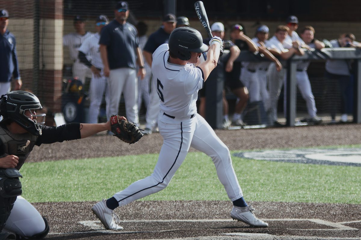 Senior Connor Bohon swings at a pitch in the zone