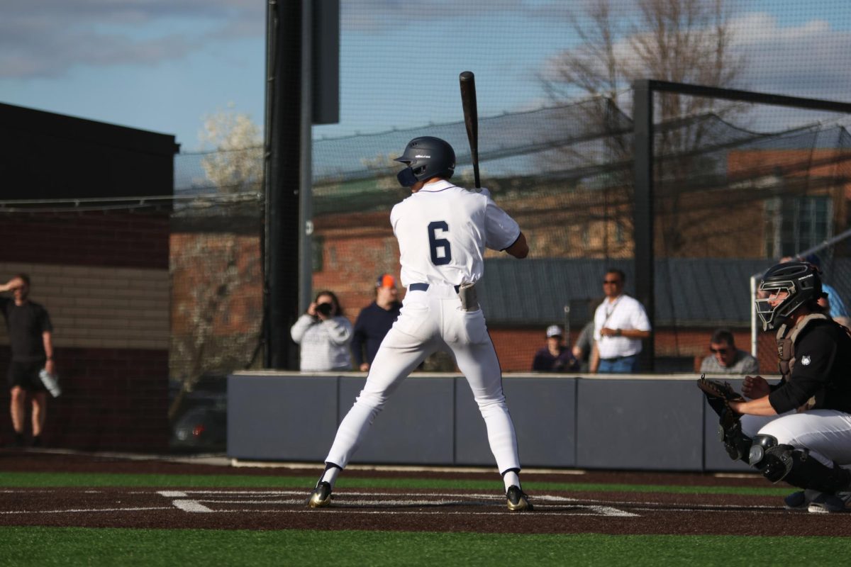 Junior Blake Jay gets athletic at the plate, preparing for the next pitch