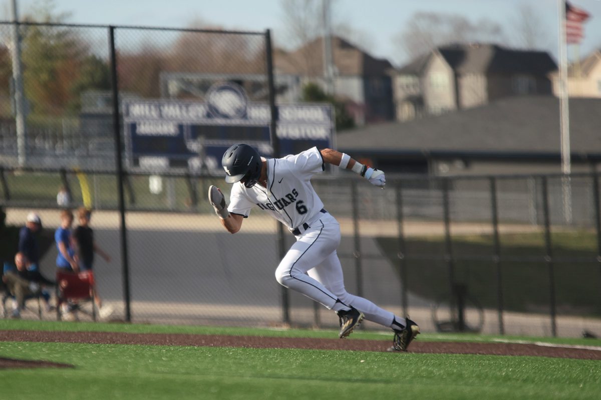 Junior Blake Jay tears into the ground as he steals second base