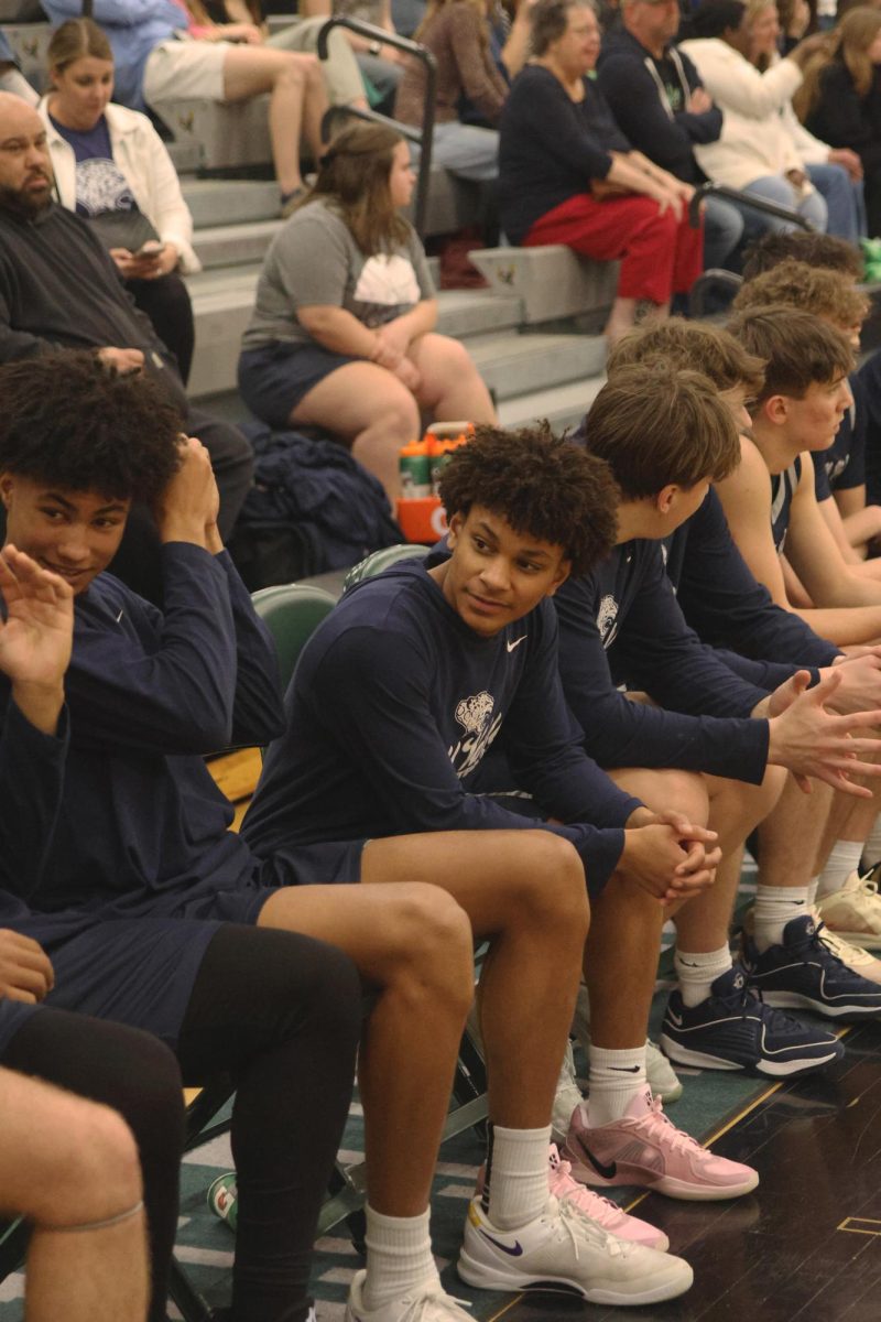 Junior Daniel Davis talks to his teammates during the game