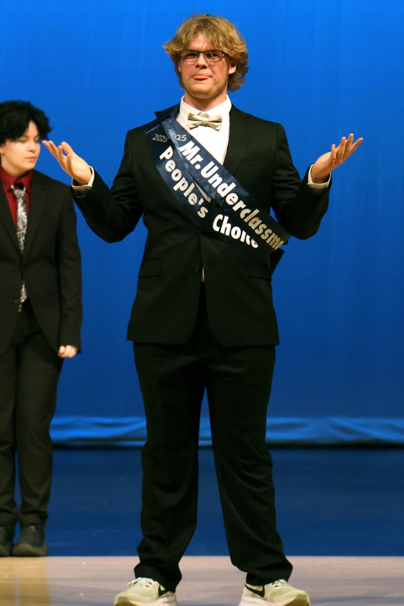 Holding his arms out, freshman Sam Thomason is recognized as “People’s Choice” winner and “Mr. Underclassman.”