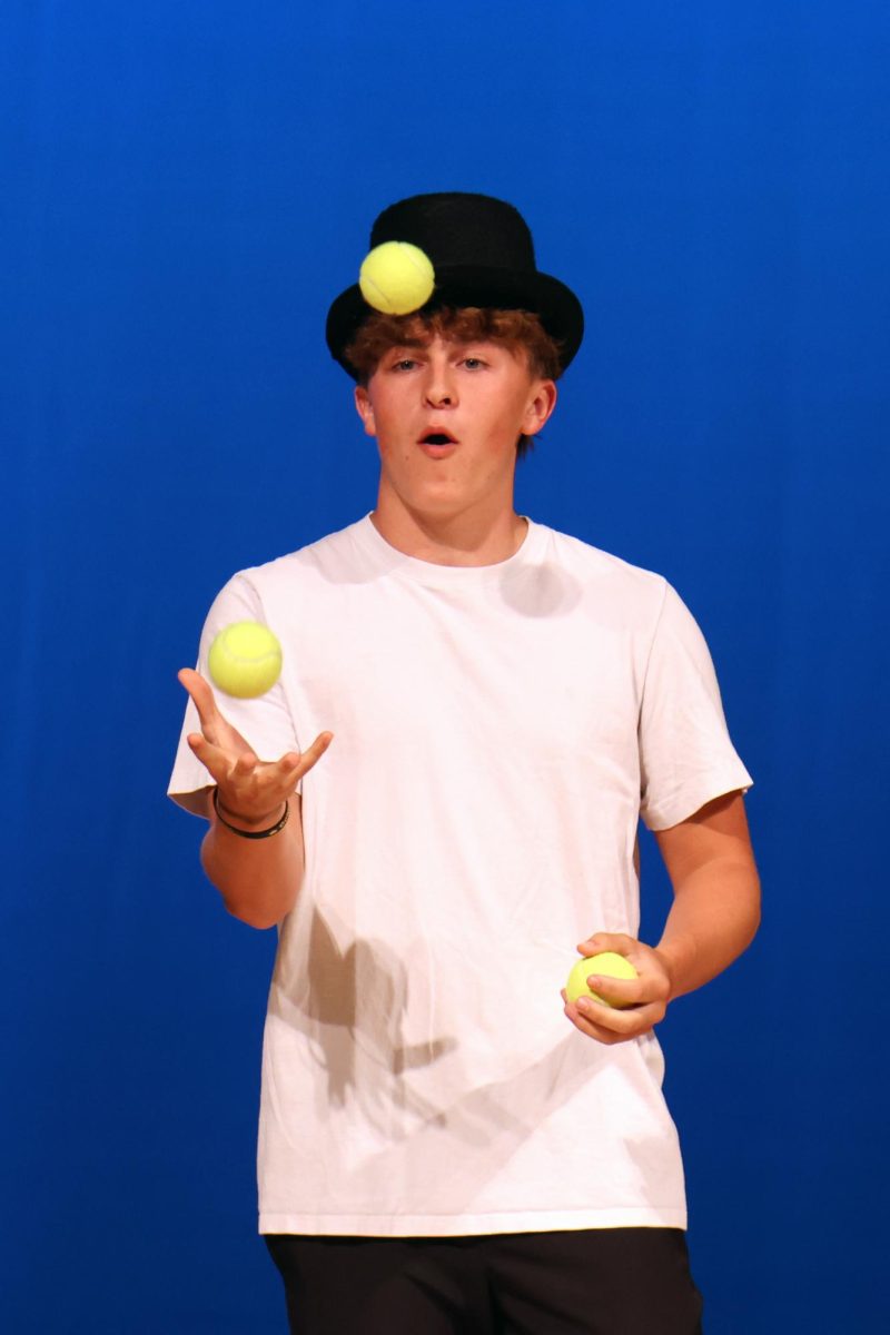 To showcase his talent, junior Gavin Hurt juggles tennis balls for the audience.
