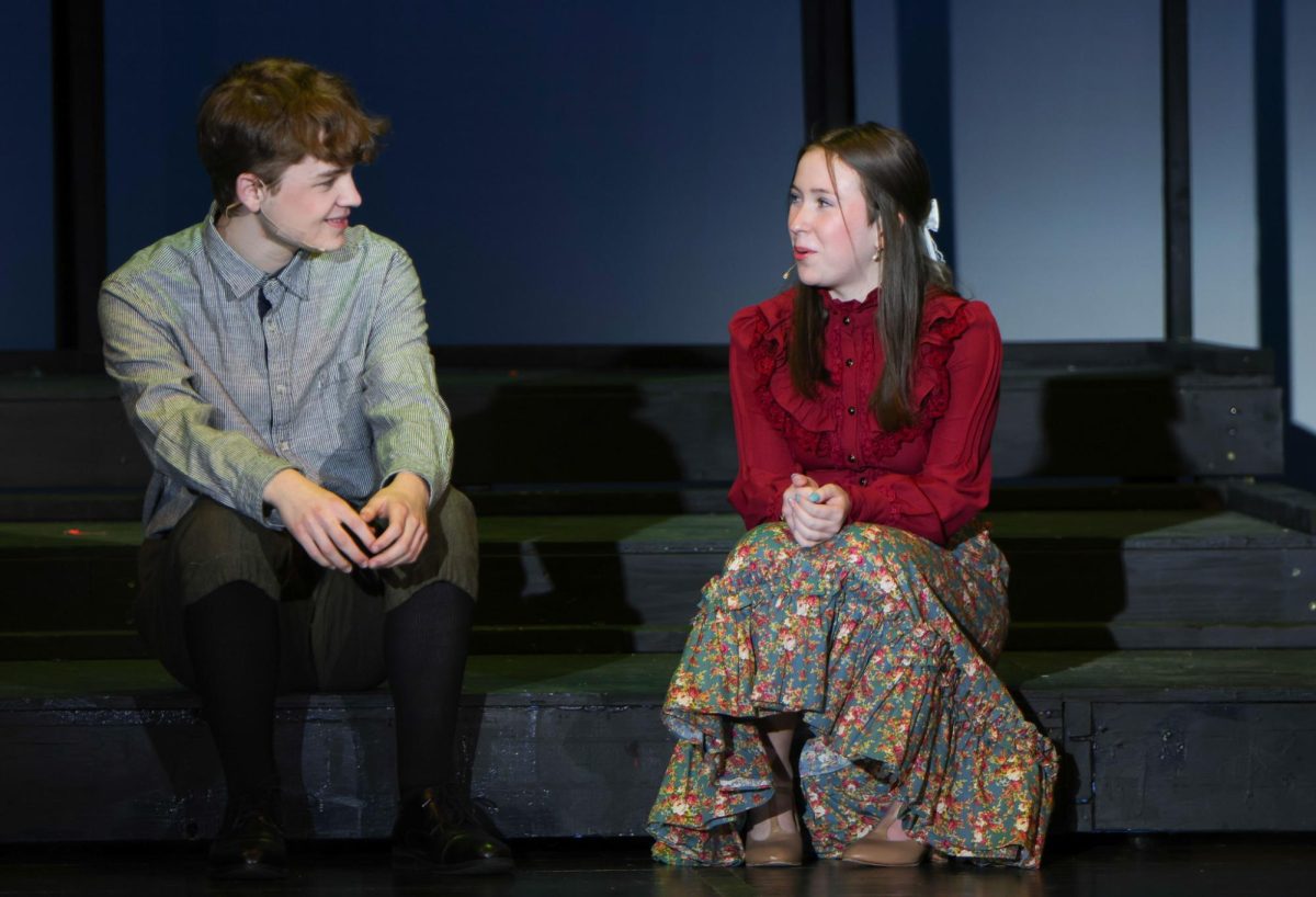 Sharing a moment, George Gibbs and Emily Webb, played by junior Harrison Guest and senior Reese Miller, confess their feelings for eachother. 
