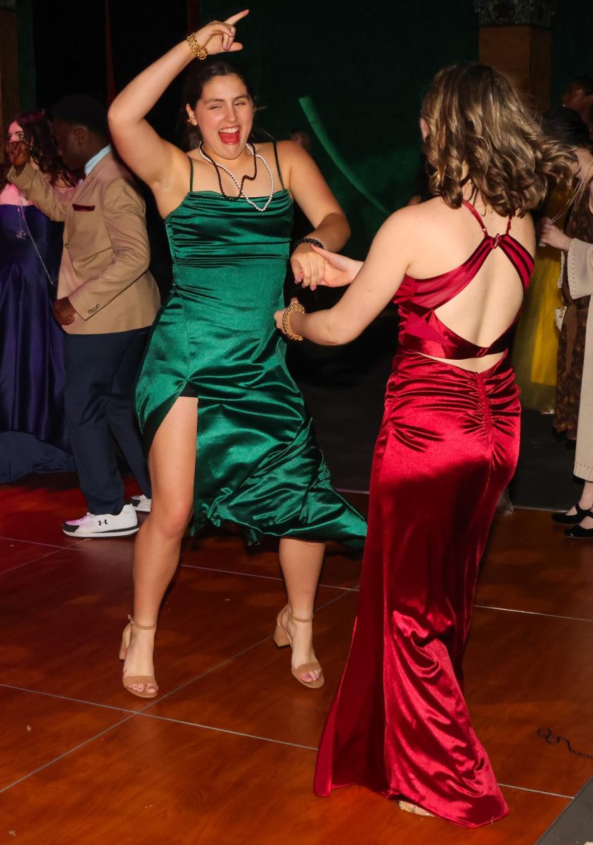 Jumping up, sophomore Lacey Jennings dances along to the music.
