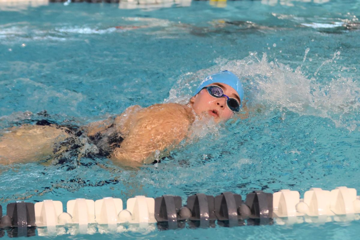 Junior McKinley Kendall swims the 100Y freestyle.