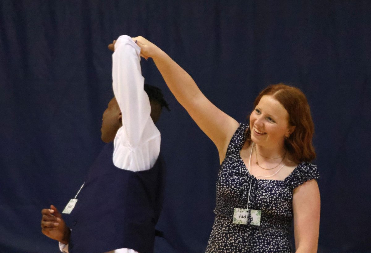 Spinning each other around, sophomore Hadley Doyle and freshman Tyrese Davis dance with each other.