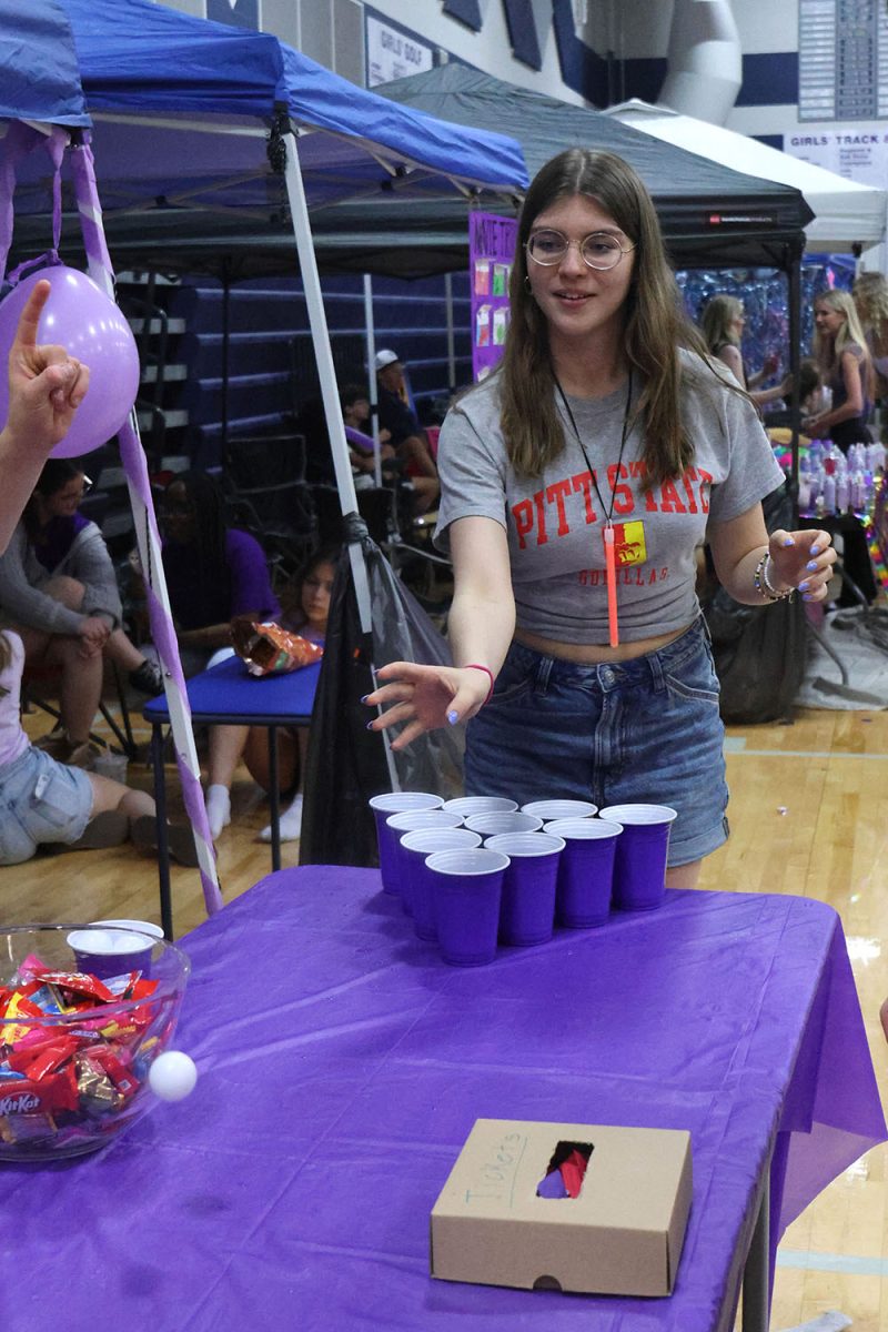 Throwing the ping pong ball, senior Joah Clark supports Relay For Life. 