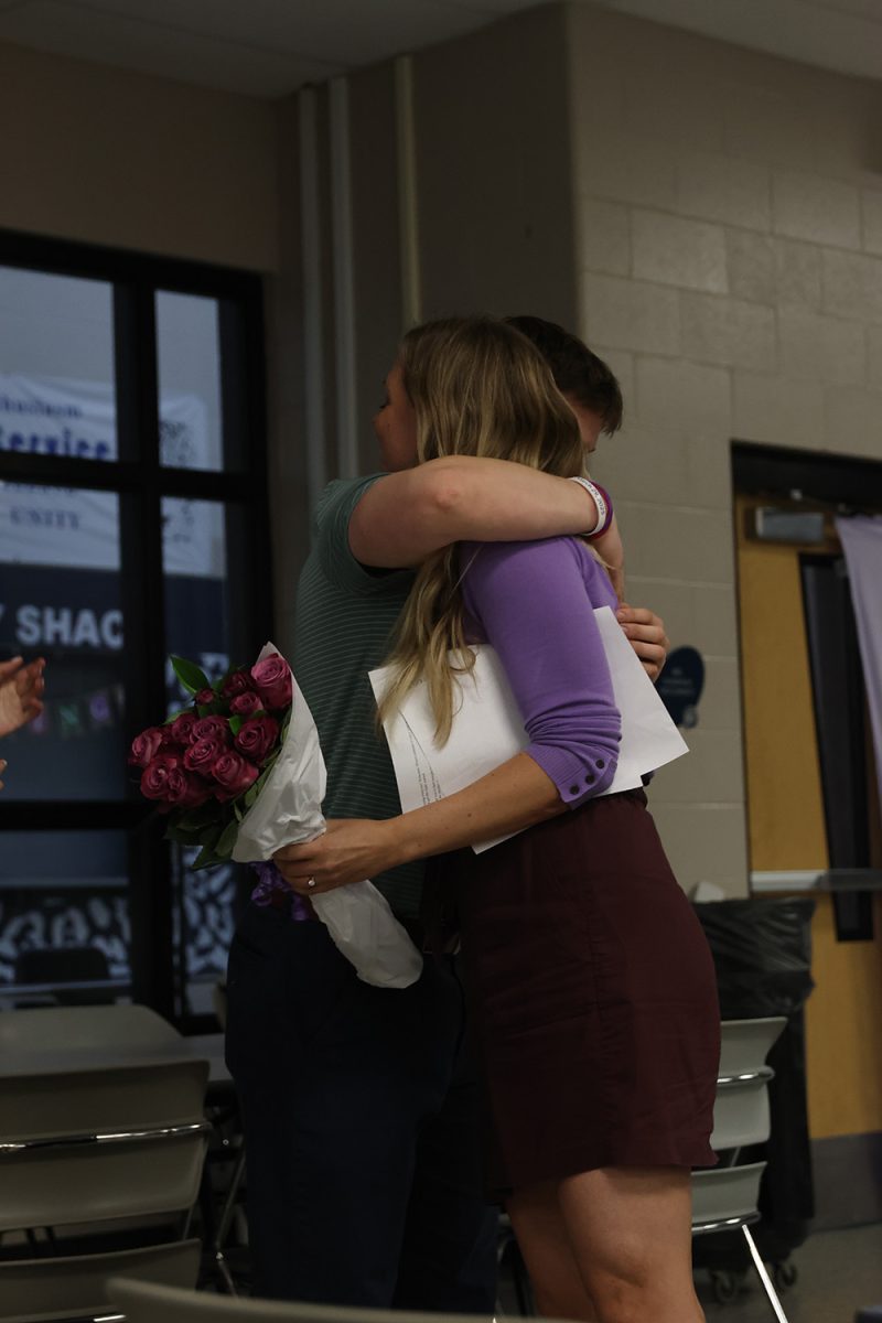After a heartfelt speech, senior Matthew Tieman hugs Relay sponsor Kirsten Jones. 