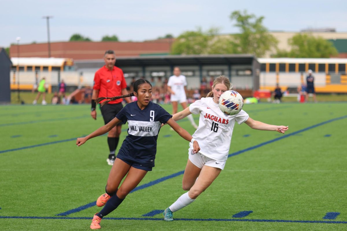 With an opponent on her back, sophomore Lyci Manirad attempts to take possession of the ball.