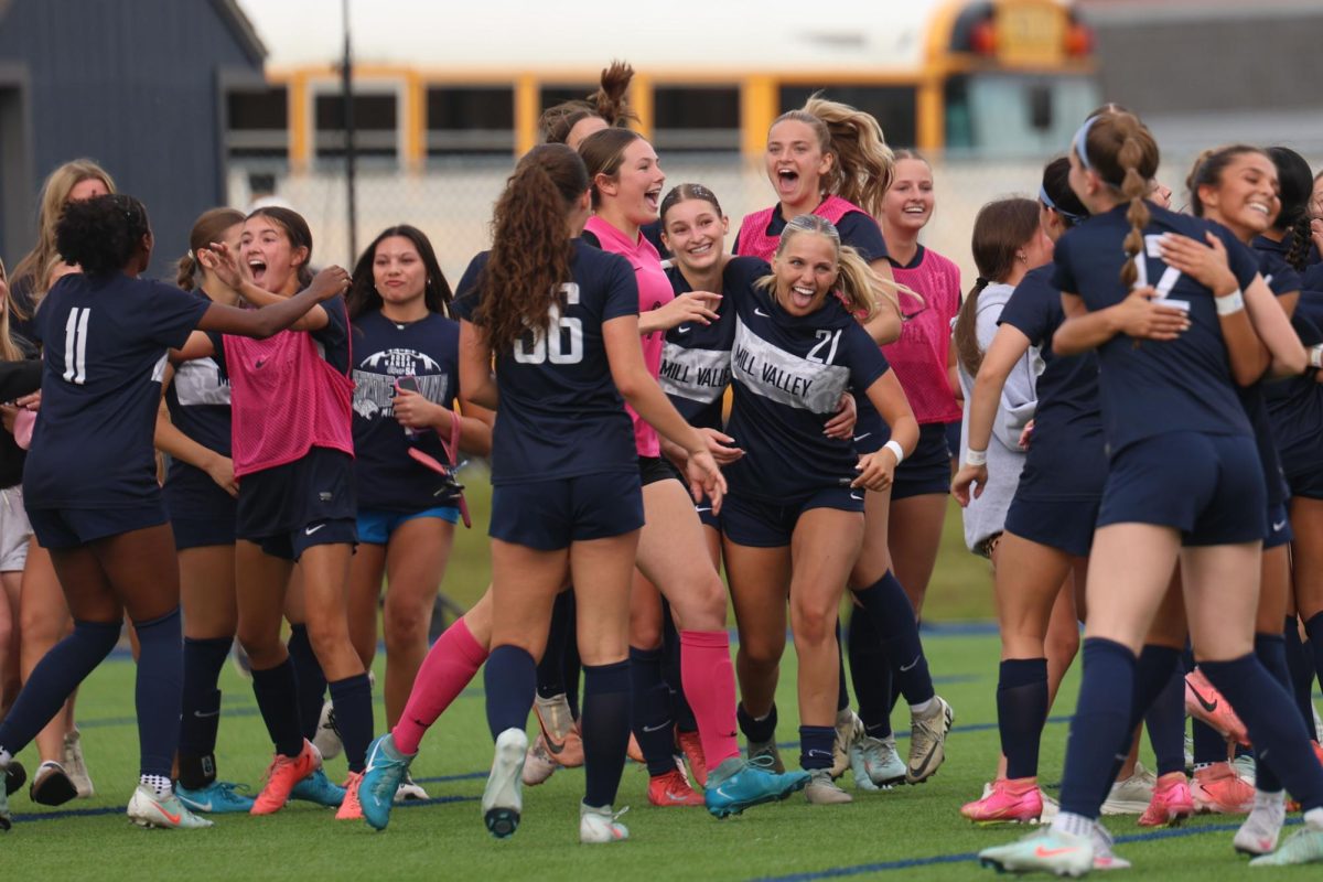 The girls soccer team celebrates after winning the regional title.
