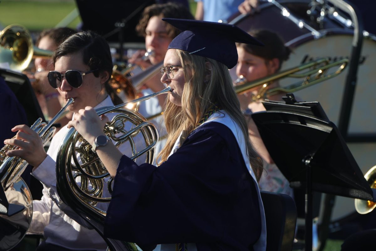 Looking at her music, senior Marissa Akehurst performs in her last high school band performance.
