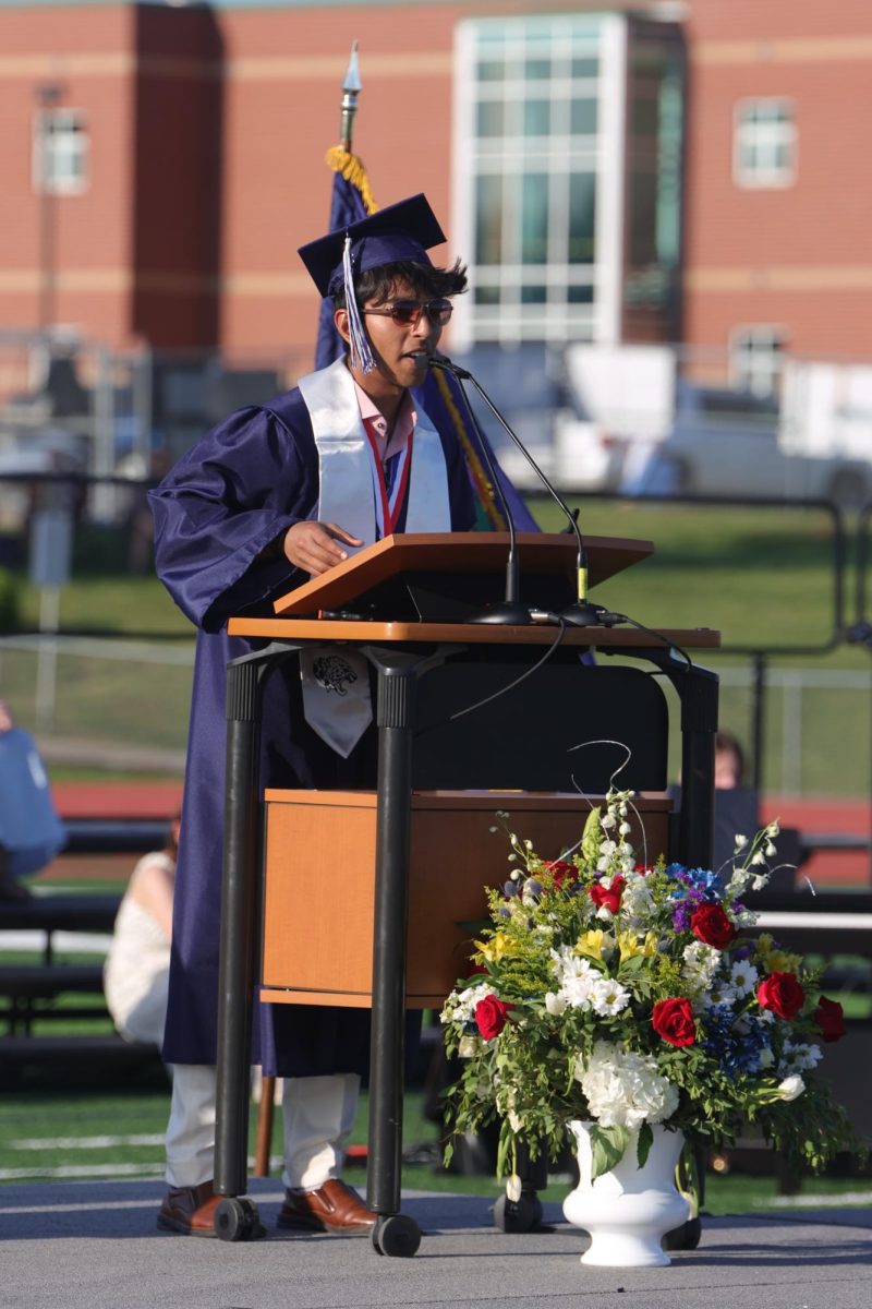 Standing on the stage, senior Shubh Patel gives his valedictorian speech. 
