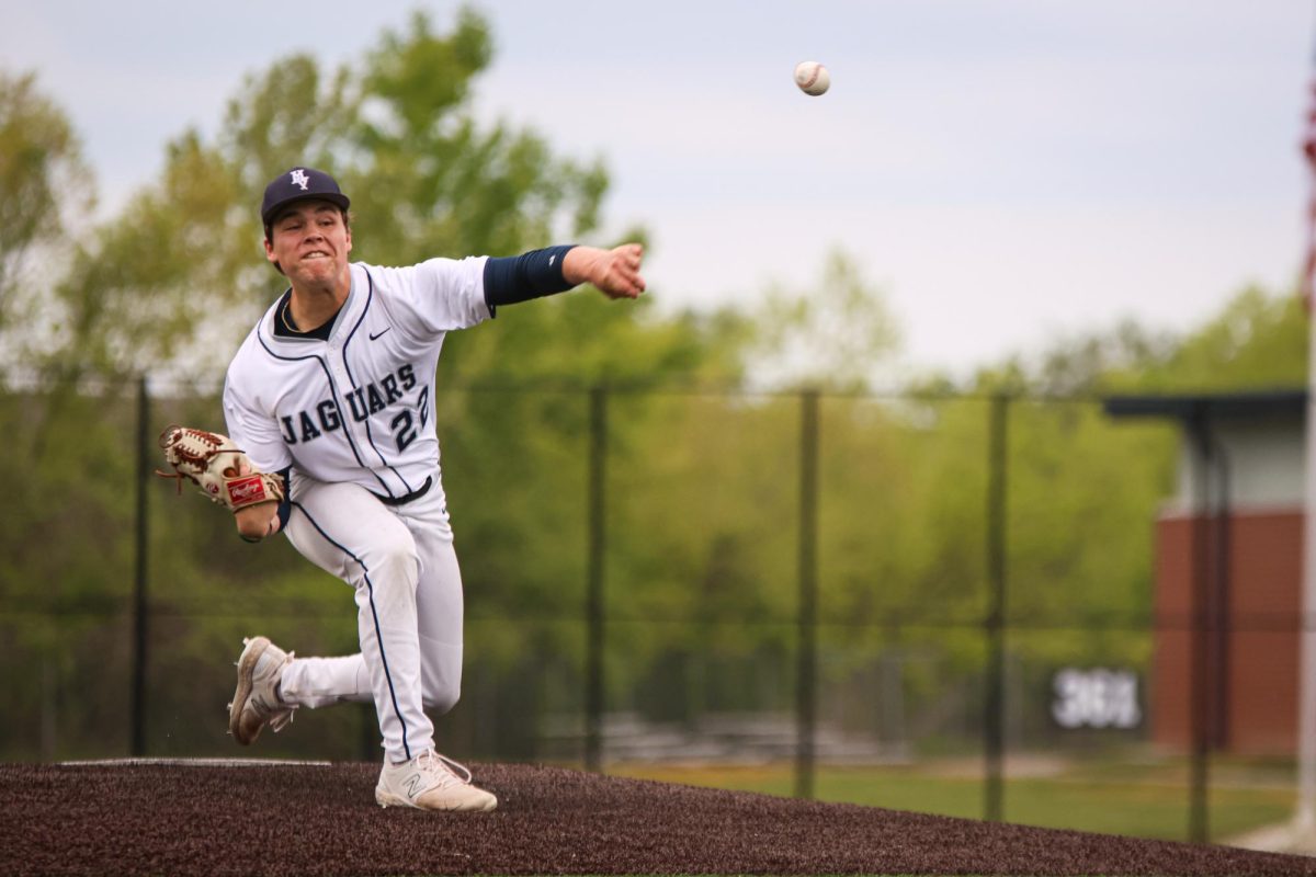 Stepping down the mound, senior Isaac Lightcap throws a pitch.