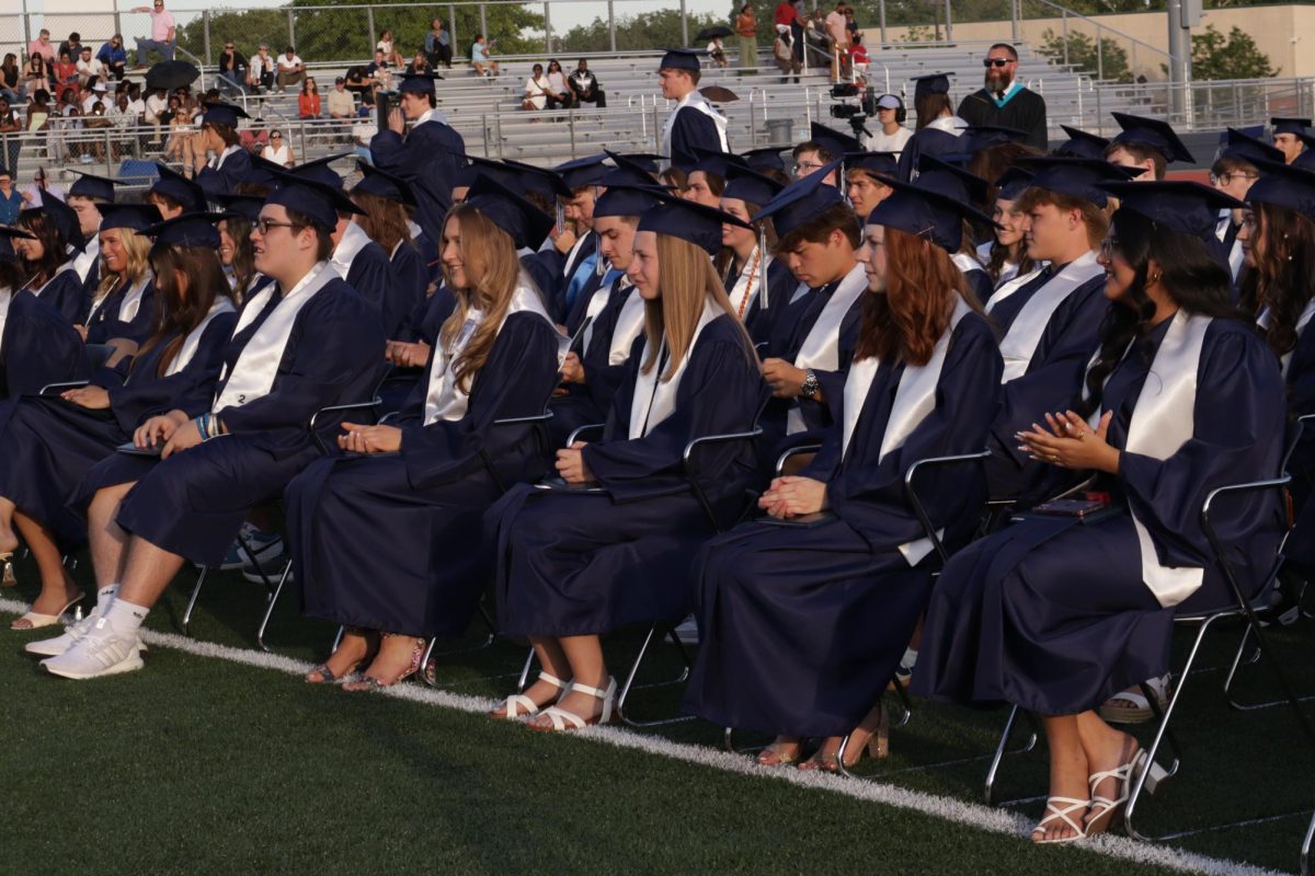 The seniors cheer on their friends as they walk the stage.