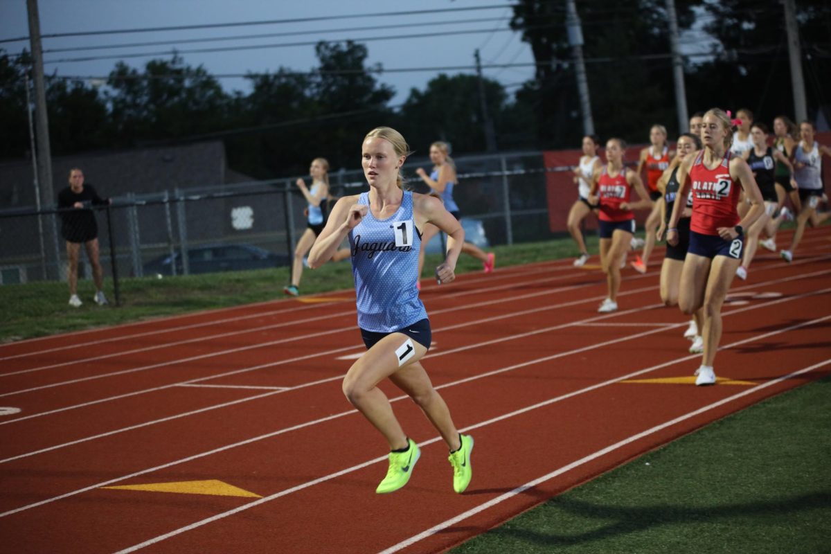 Leading the pack, senior Charlotte Caldwell paces the 800 meter race.