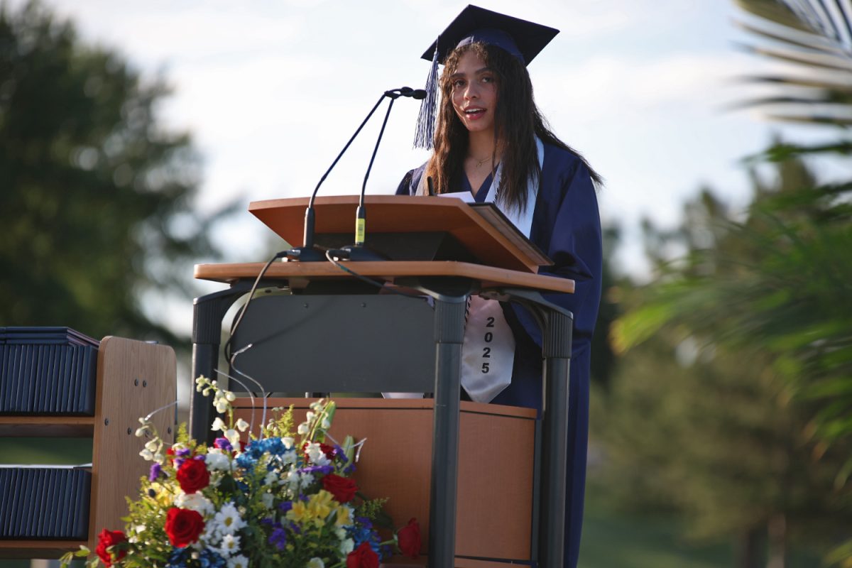 Looking out at the crowd, senior Kenzie Johnson speaks about her struggles with mental health and perfectionism.