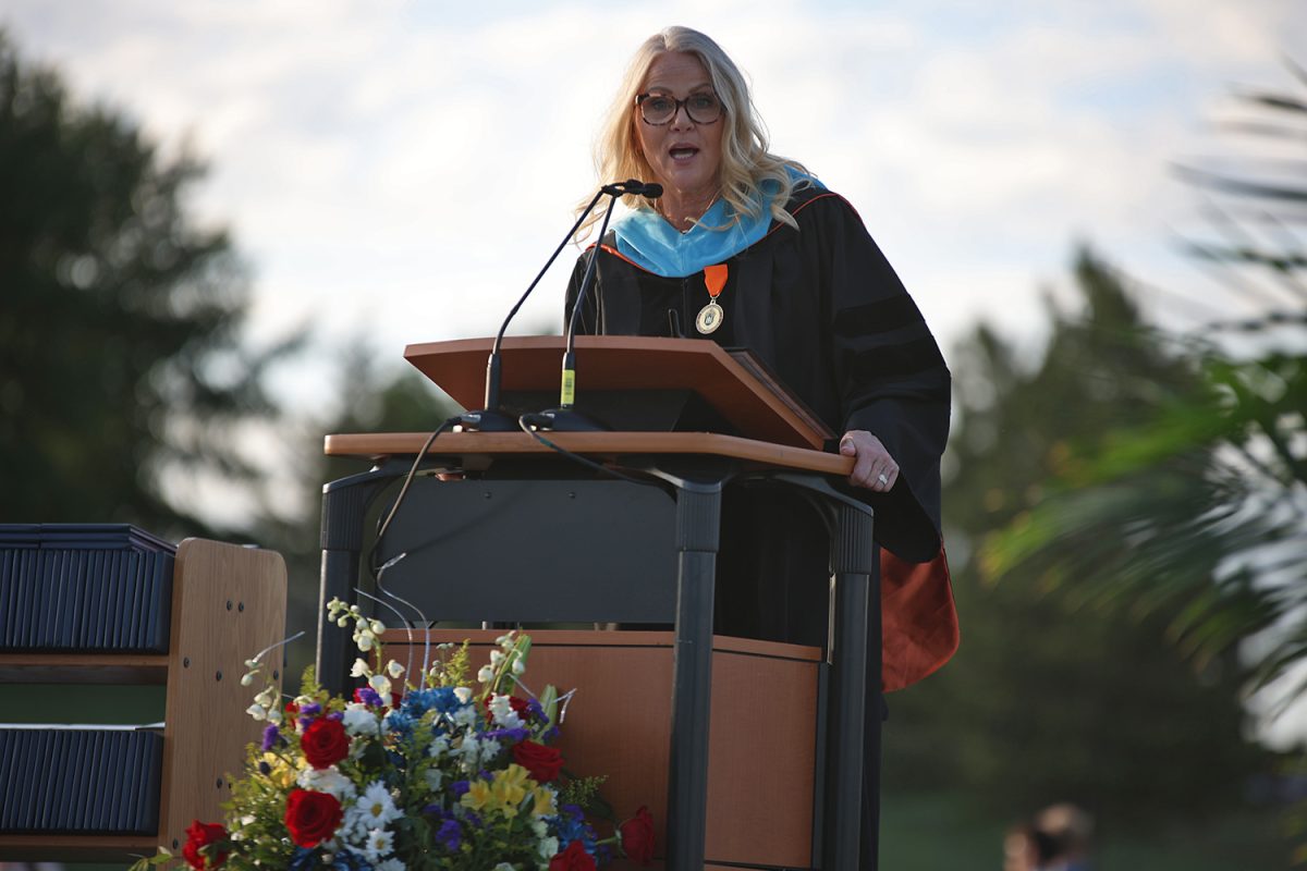 School principal Dr. Gail Holder speaks to the graduates.