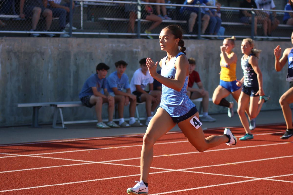 Senior Alonnah Gage takes the lead in the girls 100m dash on May 15.