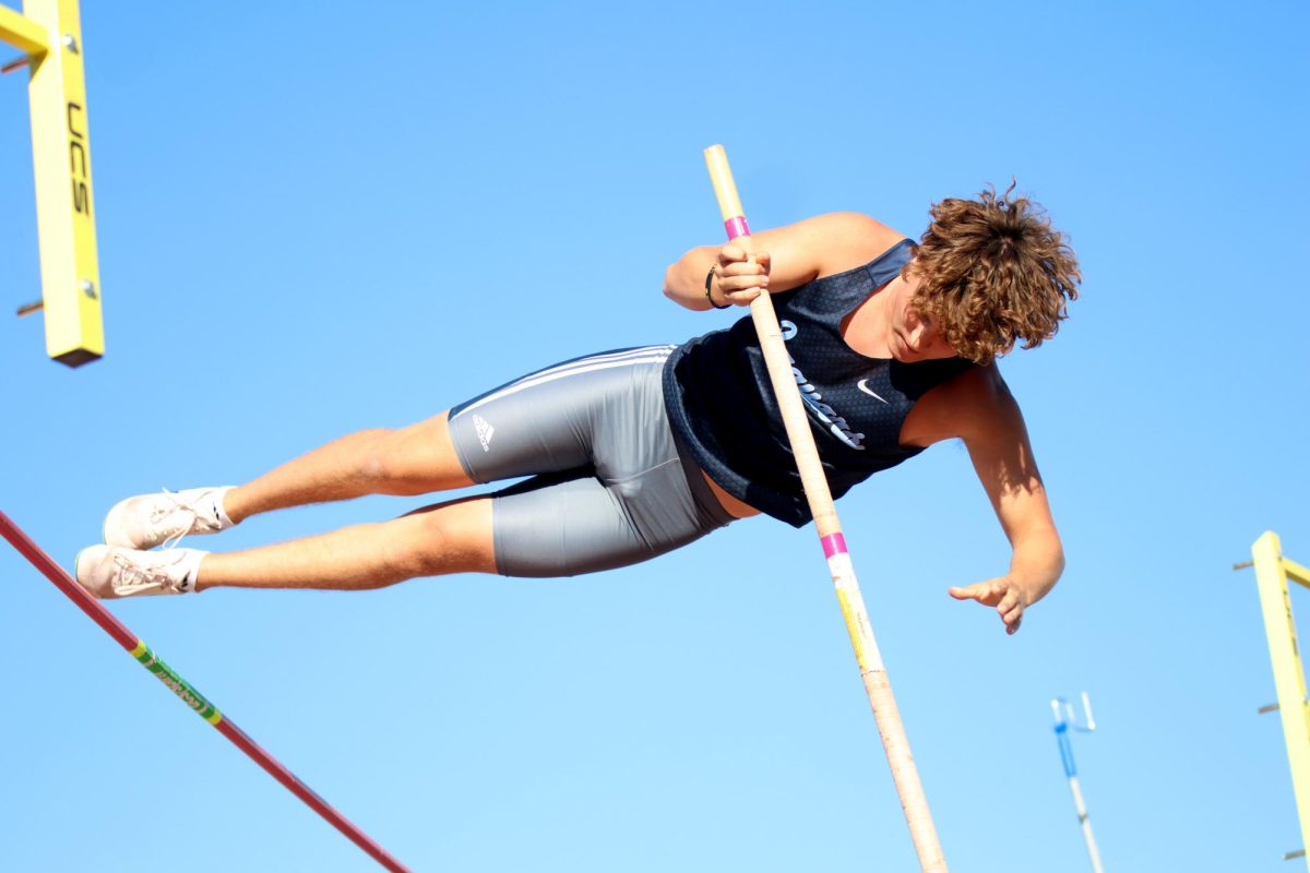 Junior Gavin Hurt clears the bar in pole vaulting on May 15. 